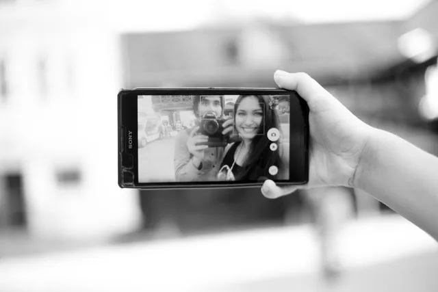 selfie, ideas, how to take a beautiful selfie, smartphone, young woman, boy, stunning, together, eyes, young, man, beautiful, photosession, street, hands, phone, camera. Celebrity lookalike photo uploads: what a reverse image search reveals