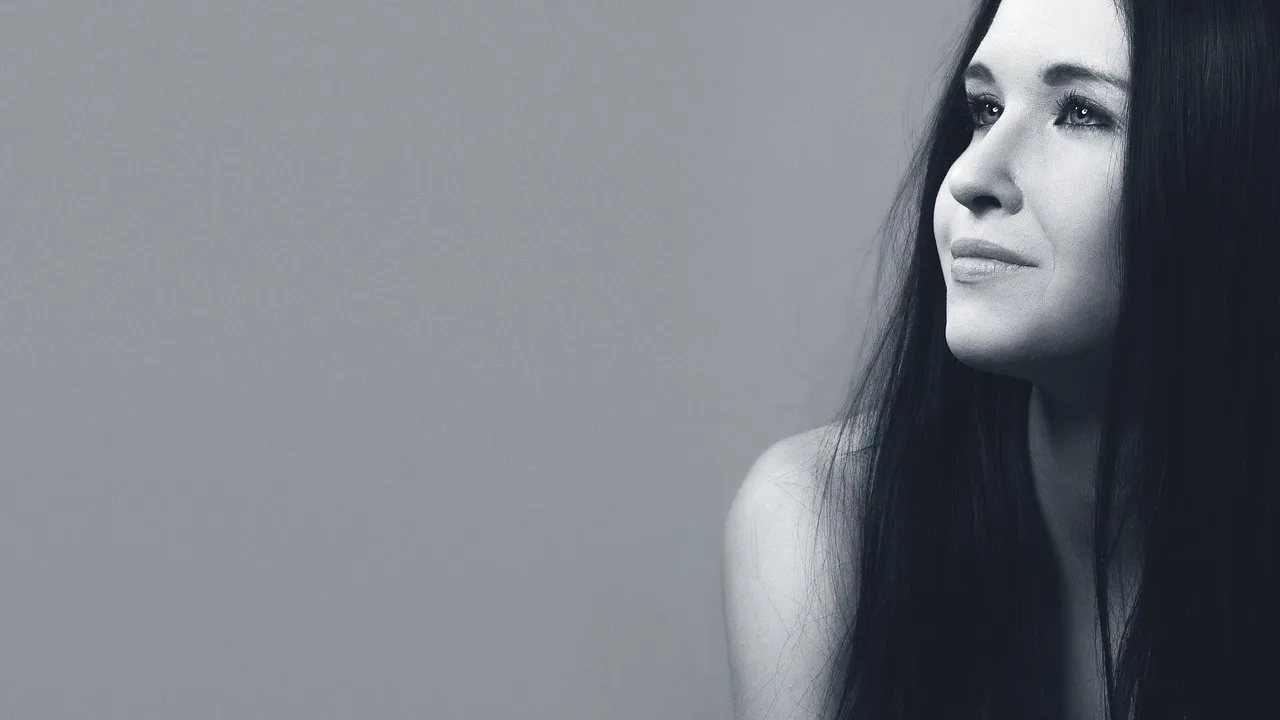 girl, portrait, smile, hair, model, person, woman, female, long hair, profile, monochrome, black and white, studio photography, smile, smile, smile, smile, smile, hair, hair, hair, profile, profile. What a photograph hides in a lookalike comparison: distance, light, expression
